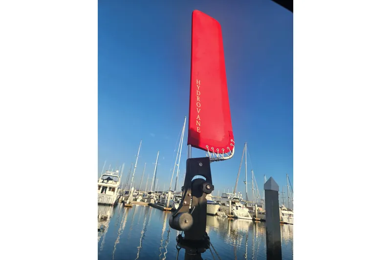 Slide: The Image of Red Hydrovane wind vane on Island Packet 370 sailboat, 2006, docked in marina. - 18