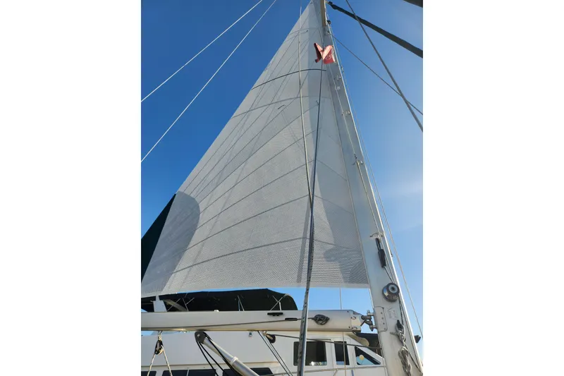Slide: The Image of Sail of 2006 Island Packet 370 yacht against clear blue sky. - 20
