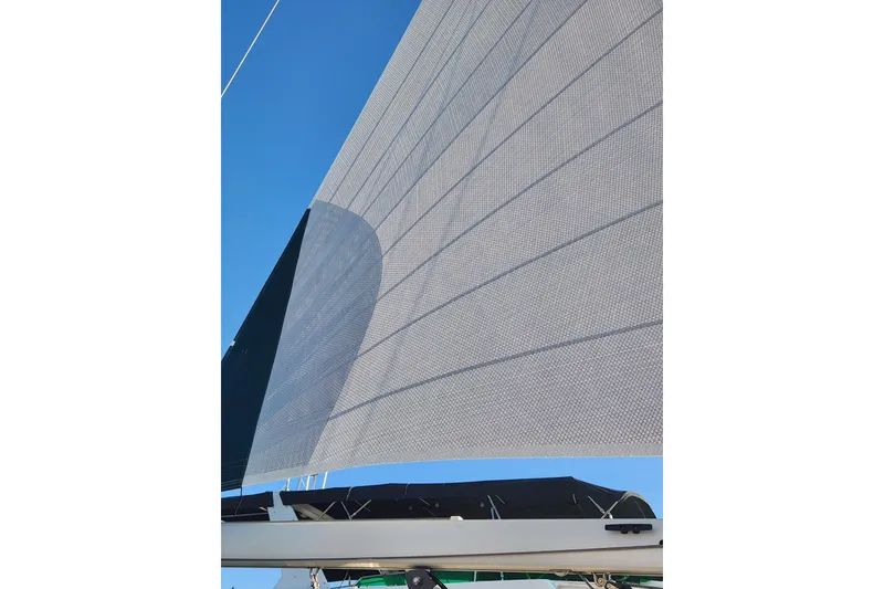 Slide: The Image of Sail of 2006 Island Packet 370 yacht against clear blue sky. - 21