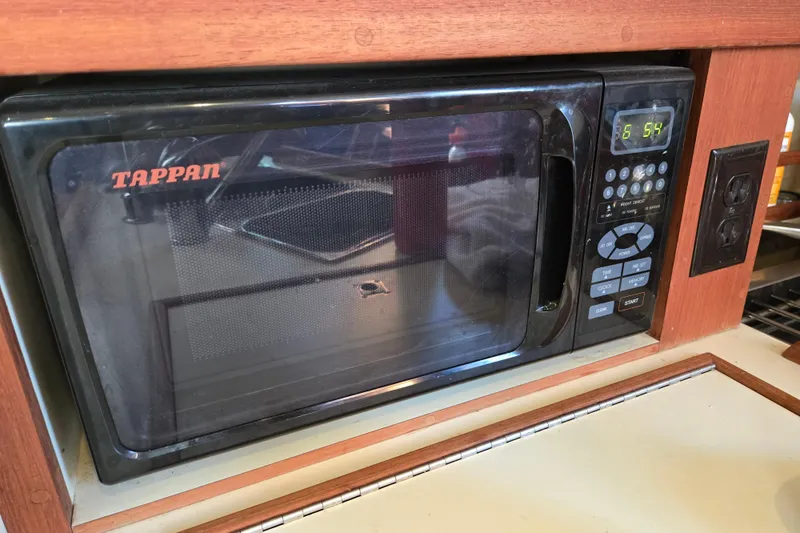 Slide: The Image of Tappan microwave in a 2006 Island Packet 370 yacht kitchen setup. - 38