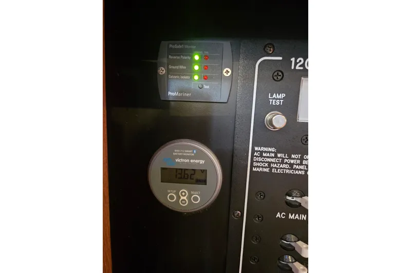 Slide: The Image of Electrical panel of 2006 Island Packet 370 sailboat with Victron Energy monitor. - 42