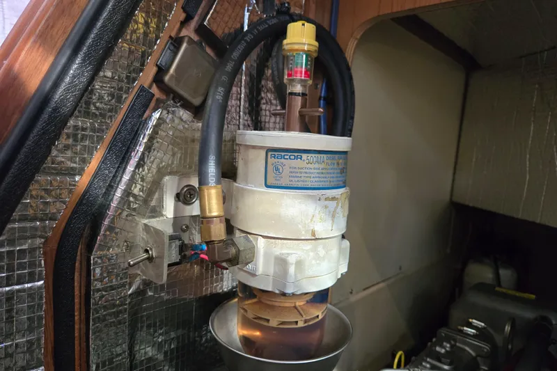 Slide: The Image of Fuel filter system in a 2006 Island Packet 370 sailboat engine compartment. - 46