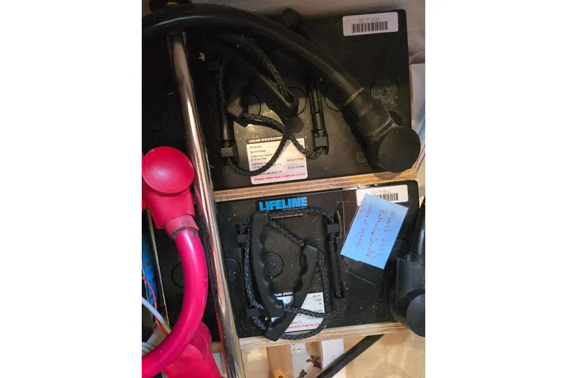 Slide: The Image of Battery compartment of a 2006 Island Packet 370 sailboat with Lifeline batteries. - 49