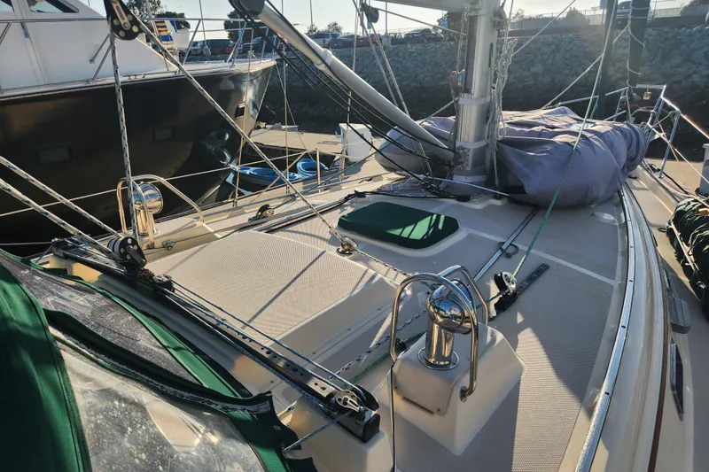 Slide: The Image of 2006 Island Packet 370 sailboat deck with rigging and equipment in marina. - 5