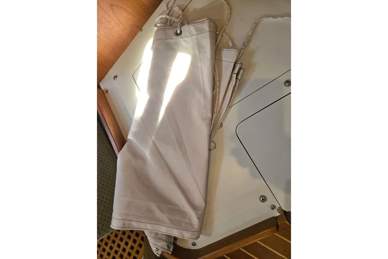 Slide: The Image of White sailcloth on Island Packet 370 yacht, 2006 model, with wooden and metal details. - 50