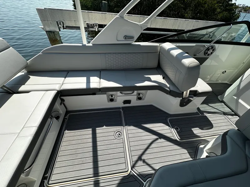 Slide: The Image of Interior of 2023 Sea Ray SDX 250 Outboard with gray upholstery. - 12