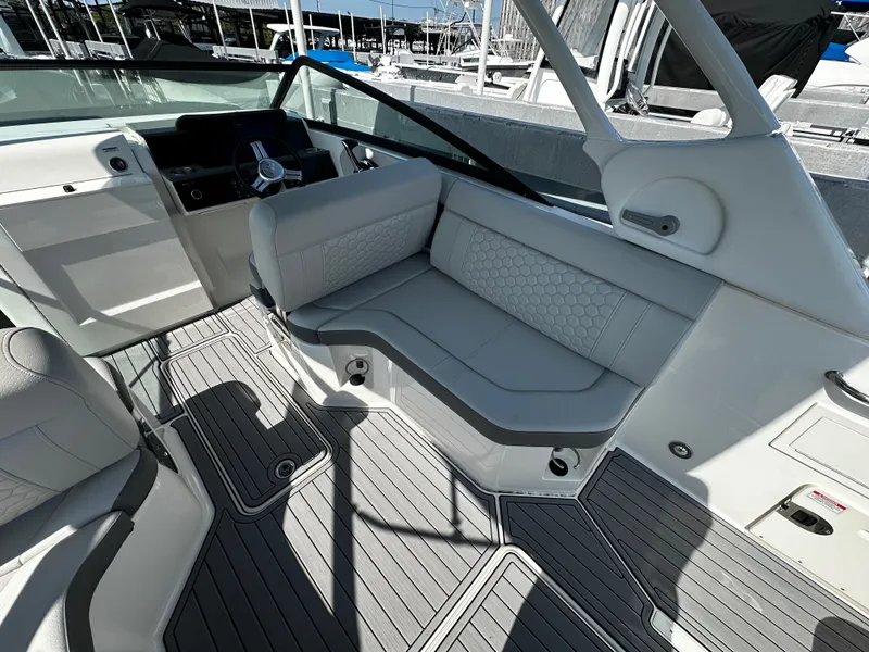 Slide: The Image of Interior of 2023 Sea Ray SDX 250 Outboard with gray upholstery. - 14