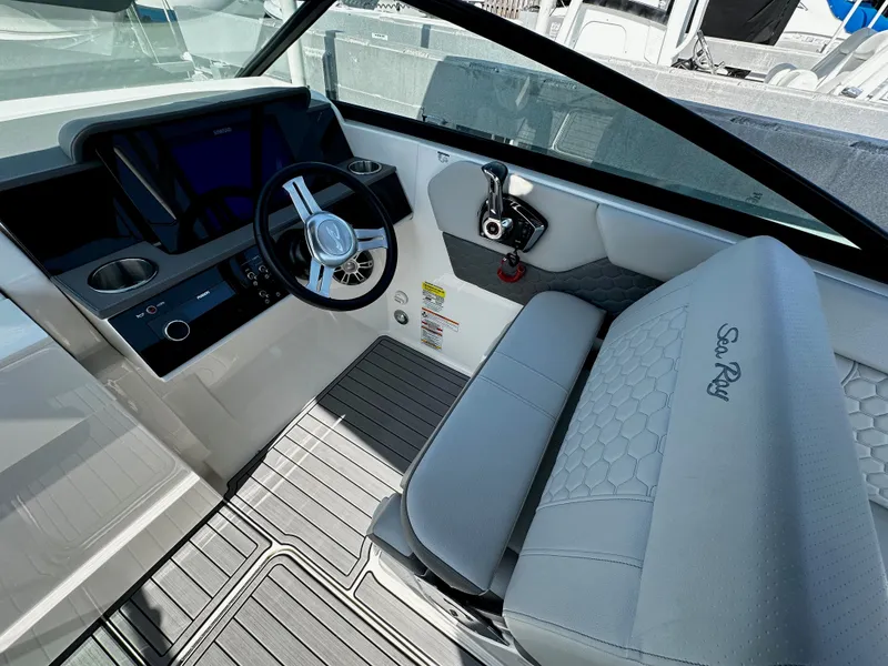Slide: The Image of Interior of 2023 Sea Ray SDX 250 Outboard with steering wheel and seat. - 16