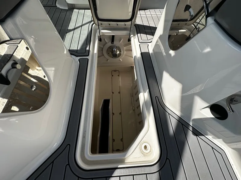 Slide: The Image of Storage compartment in Sea Ray SDX 250 Outboard 2023 boat. - 20