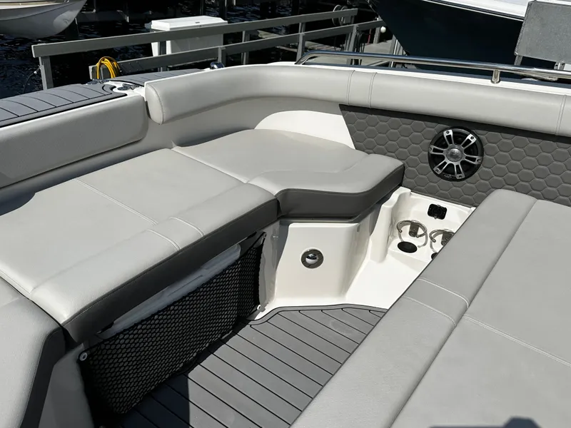Slide: The Image of Interior of 2023 Sea Ray SDX 250 Outboard with gray upholstery. - 25