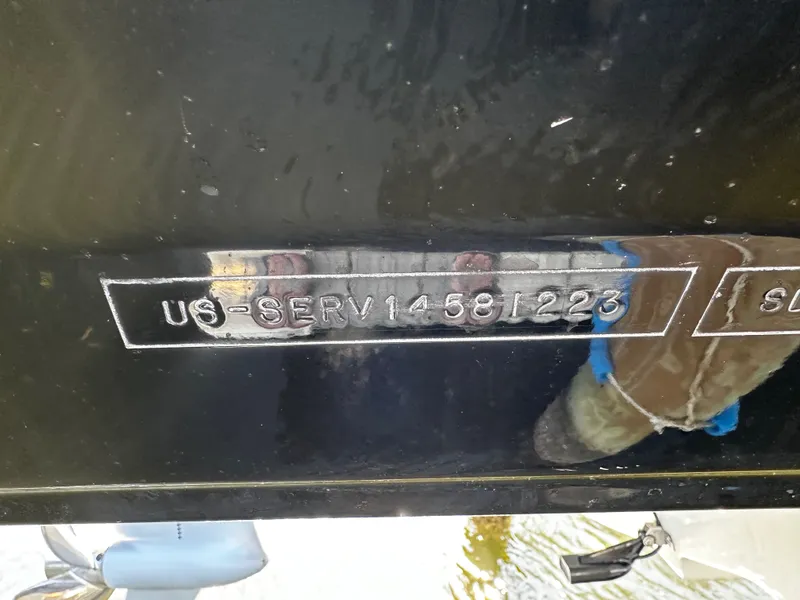 Slide: The Image of Serial number of Sea Ray SDX 250 Outboard 2023 on black background. - 35