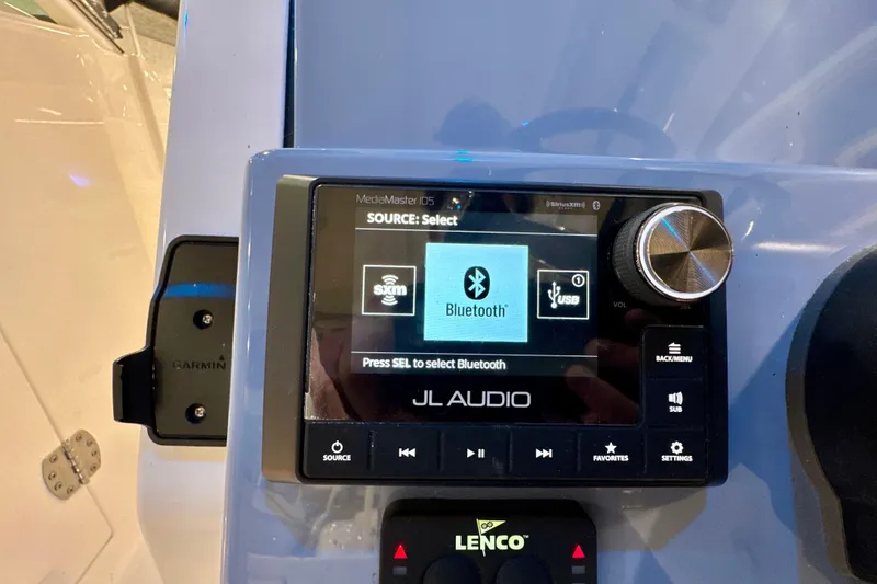 Slide: The Image of 2024 Pursuit DC 266 Dual Console boat audio system with Bluetooth connectivity display. - 19