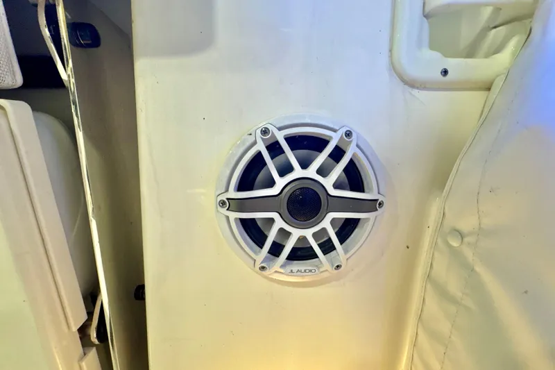 Slide: The Image of JL Audio speaker on 2024 Pursuit DC 266 Dual Console boat interior. - 34