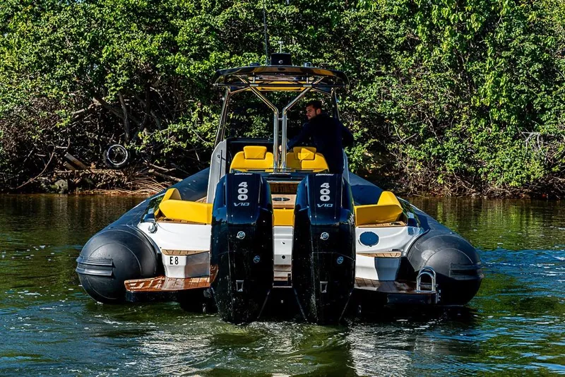 Slide: The Image of 2025 SACS Strider 11 boat with dual 400 V10 engines on a scenic waterway. - 10