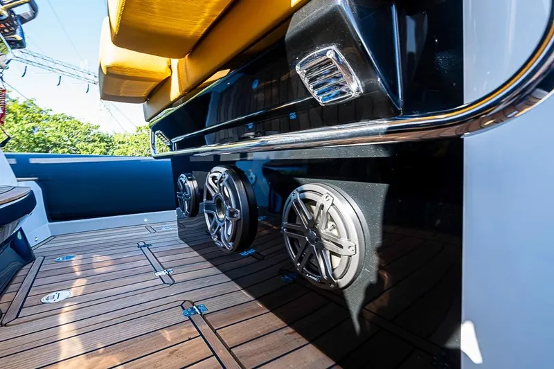 Slide: The Image of 2025 SACS Strider 11 boat interior with teak flooring and premium audio speakers. - 17