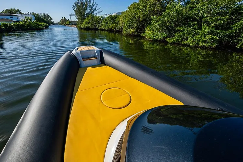 Slide: The Image of 2025 SACS Strider 11 navigating a serene, tree-lined waterway. - 19