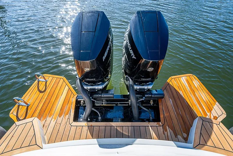 Slide: The Image of 2025 SACS Strider 11 with dual Mercury outboard engines on teak deck. - 28