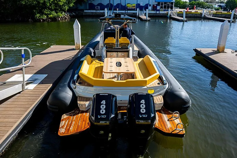 Slide: The Image of 2025 SACS Strider 11 boat docked, featuring dual Mercury 400 V10 engines. - 29