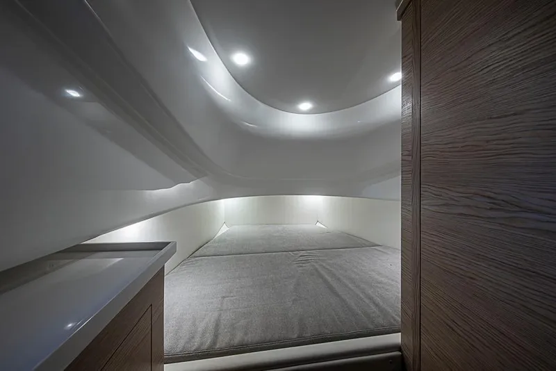 Slide: The Image of Interior cabin of 2025 SACS Strider 11 with modern lighting and wood accents. - 33