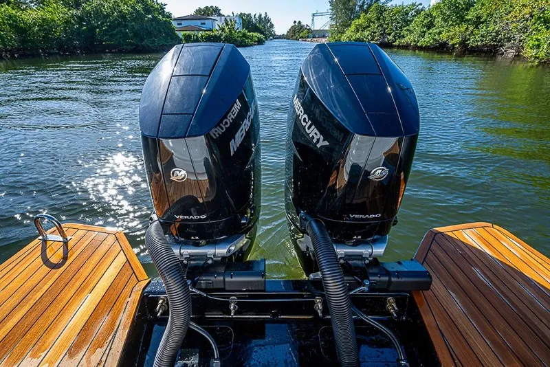 Slide: The Image of 2025 SACS Strider 11 with dual Mercury Verado engines on a sunny waterway. - 39