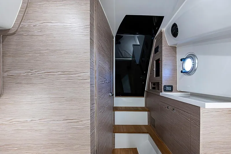 Slide: The Image of Interior of 2025 SACS Strider 11 yacht with modern wood paneling and sleek design. - 35