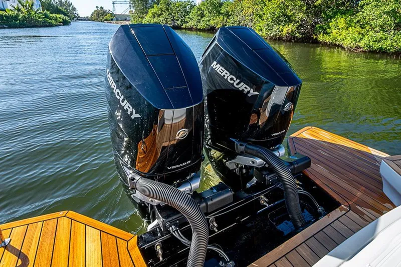 Slide: The Image of 2025 SACS Strider 11 with dual Mercury Verado engines on a wooden deck. - 41