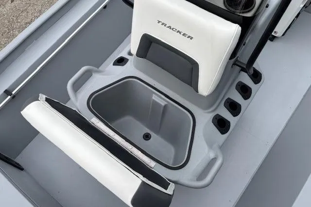 Slide: The Image of 2026 Tracker Bass Tracker Classic CC boat seat with storage compartment and cup holders. - 10