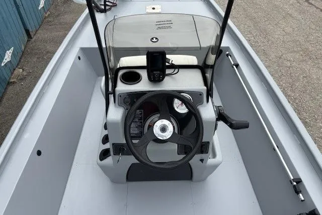 Slide: The Image of 2026 Tracker Bass Tracker Classic CC boat console with steering wheel and navigation equipment. - 11