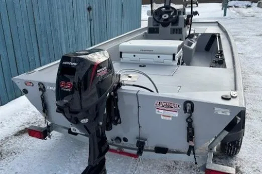 Slide: The Image of 2026 Tracker Bass Tracker Classic CC boat with Mercury outboard motor on snowy ground. - 3