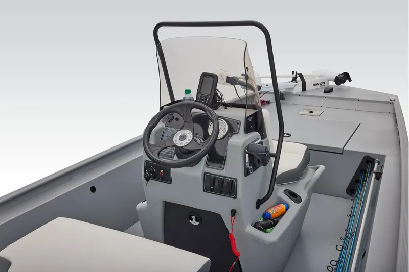 Slide: The Image of Manufacturer Provided Image: 2026 Tracker Bass Tracker Classic CC boat interior with steering console and fishing gear. - 32