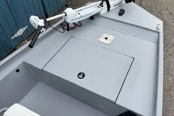 Slide: The Image of 2026 Tracker Bass Tracker Classic CC boat deck with trolling motor and storage compartment. - 4