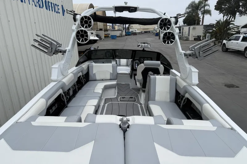 Slide: The Image of 2020 Malibu Wakesetter 25 LSV boat interior with spacious seating and advanced audio system. - 10