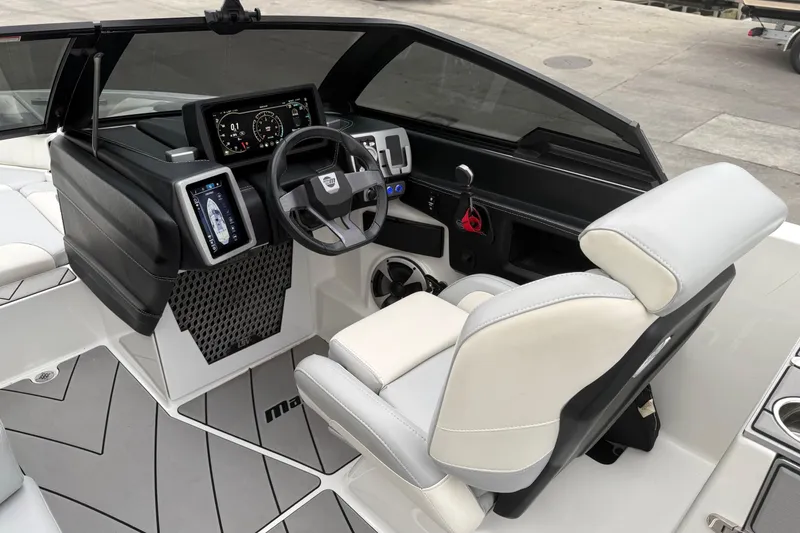 Slide: The Image of 2020 Malibu Wakesetter 25 LSV boat cockpit with modern dashboard and steering wheel. - 12