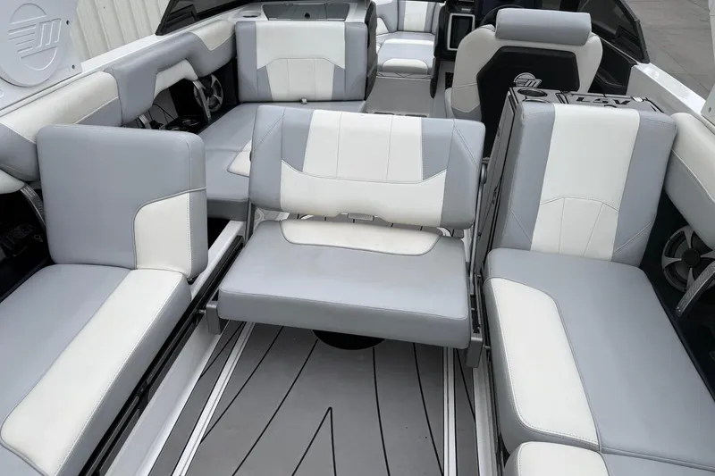 Slide: The Image of 2020 Malibu Wakesetter 25 LSV interior with gray and white seating arrangement. - 17
