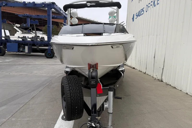 Slide: The Image of 2020 Malibu Wakesetter 25 LSV boat on trailer near sales office. - 2