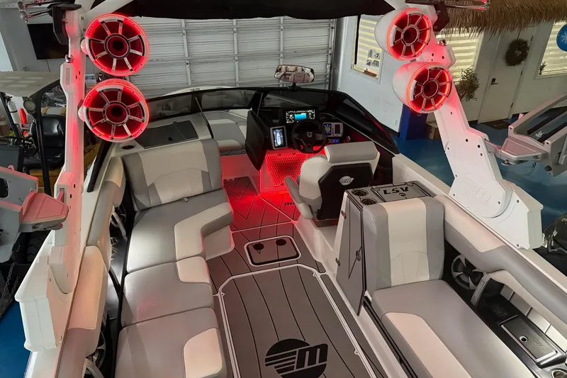 Slide: The Image of 2020 Malibu Wakesetter 25 LSV interior with red LED lighting and premium seating. - 21