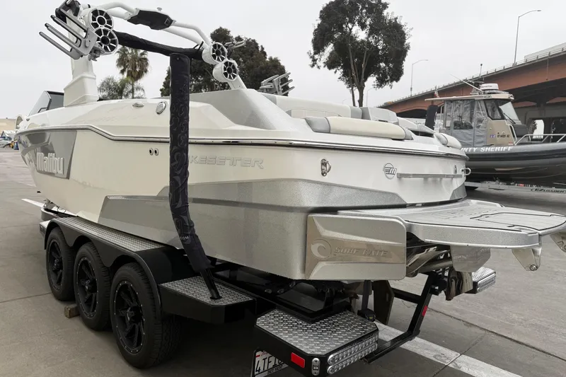 Slide: The Image of 2020 Malibu Wakesetter 25 LSV boat on trailer, featuring sleek design and advanced wakeboarding features. - 4