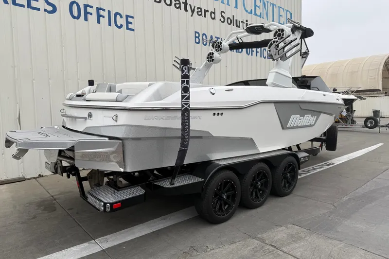 Slide: The Image of 2020 Malibu Wakesetter 25 LSV boat on trailer at dealership. - 6