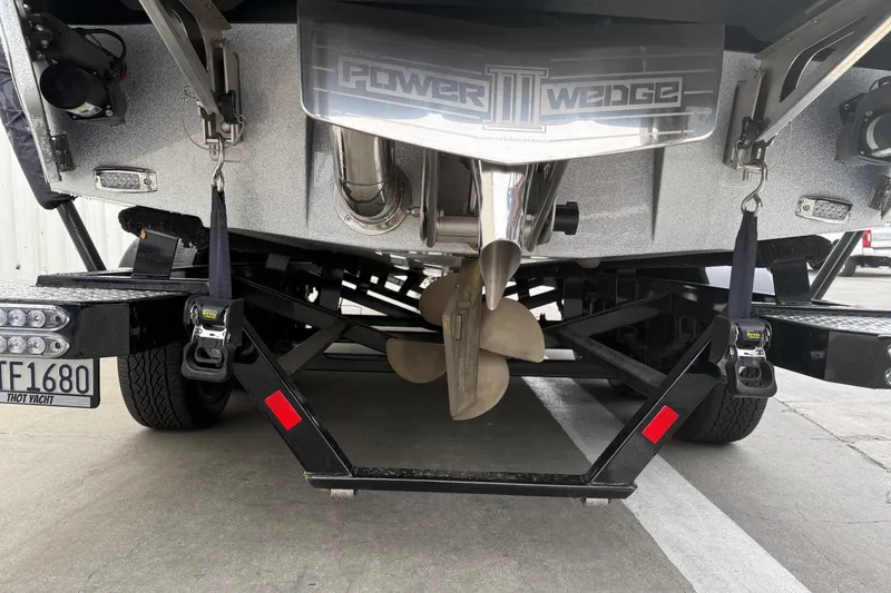 Slide: The Image of 2020 Malibu Wakesetter 25 LSV boat trailer with Power Wedge III and propeller. - 8