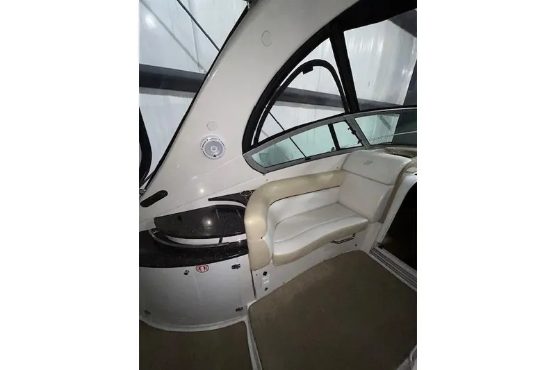 Slide: The Image of Interior of 2008 Four Winns 338 Vista boat with beige seating and sleek design. - 10