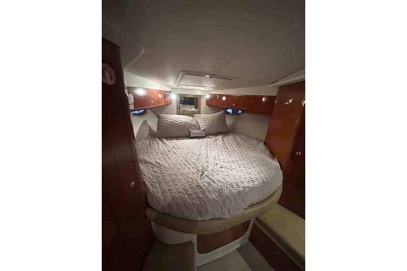 Slide: The Image of Cozy cabin interior of 2008 Four Winns 338 Vista yacht with plush bedding. - 17