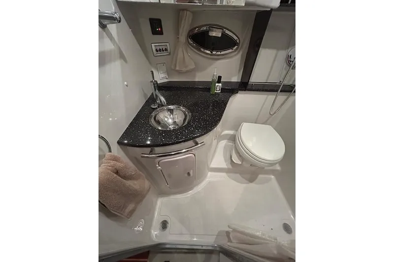 Slide: The Image of 2008 Four Winns 338 Vista boat bathroom with sink, toilet, and countertop. - 20