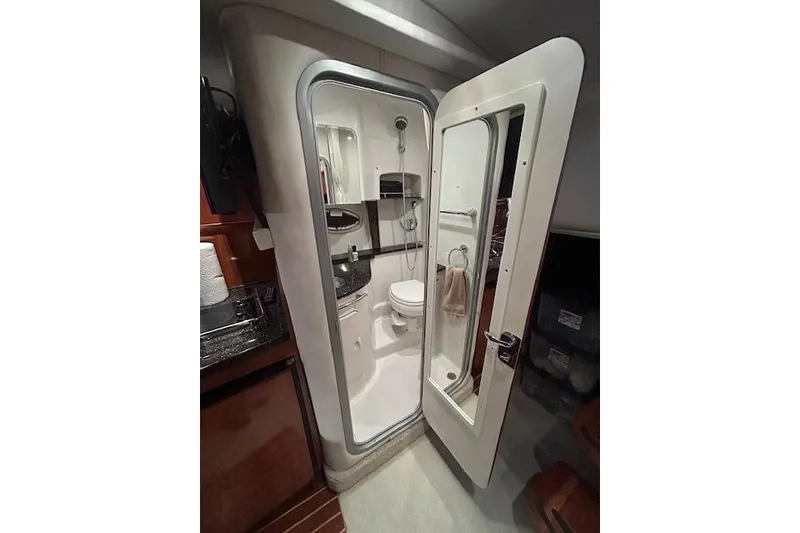 Slide: The Image of Bathroom interior of 2008 Four Winns 338 Vista yacht, featuring compact design and modern amenities. - 21