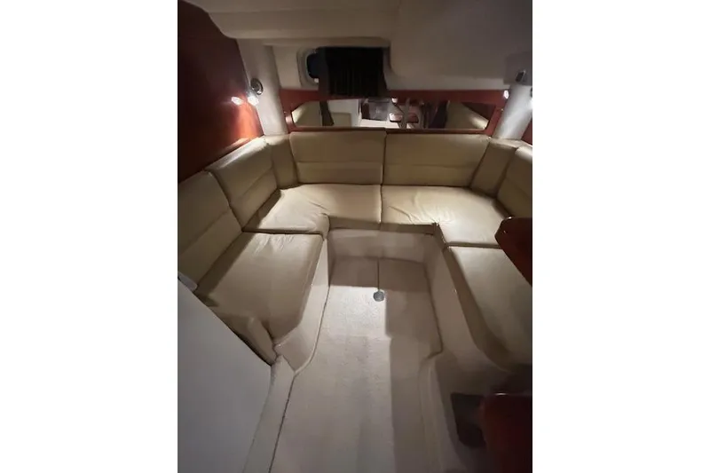 Slide: The Image of 2008 Four Winns 338 Vista interior with beige seating and ambient lighting. - 26