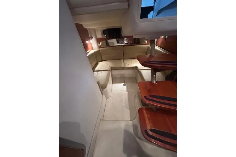 Slide: The Image of 2008 Four Winns 338 Vista interior with beige seating and wooden steps. - 27