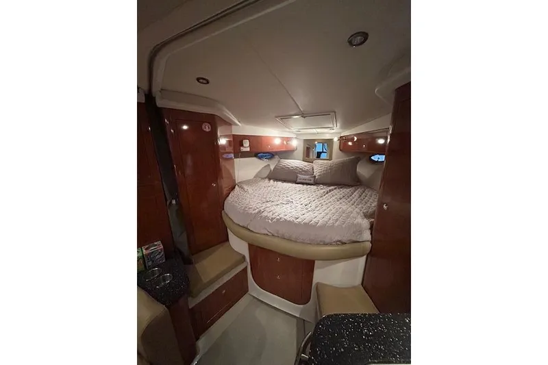Slide: The Image of Luxurious cabin interior of 2008 Four Winns 338 Vista yacht with cozy bed. - 29