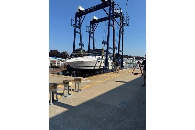 Slide: The Image of 2008 Four Winns 338 Vista boat being lifted at a marina. - 31