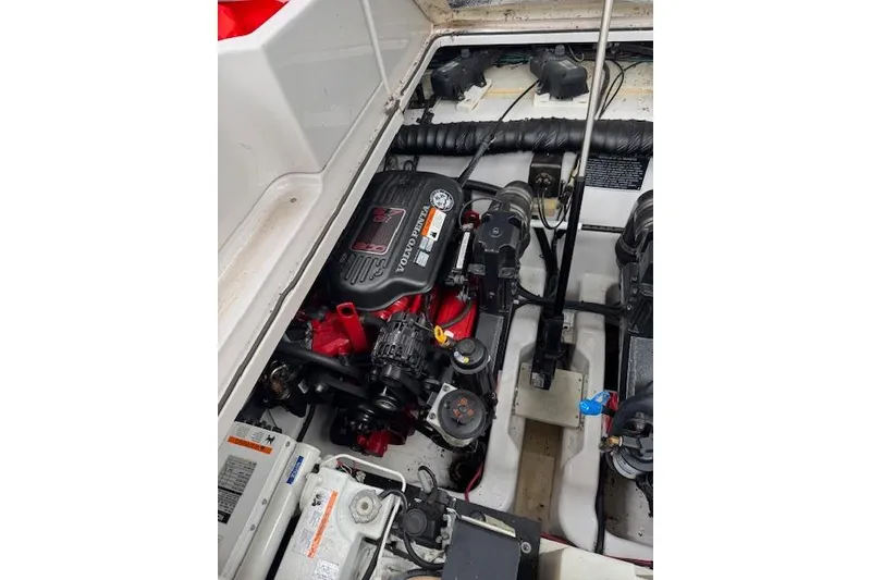 Slide: The Image of Engine compartment of a 2008 Four Winns 338 Vista boat, featuring a Volvo Penta engine. - 33
