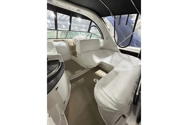 Slide: The Image of 2008 Four Winns 338 Vista boat interior with white seating and covered cockpit. - 6