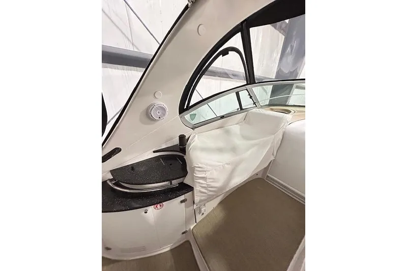 Slide: The Image of Interior view of 2008 Four Winns 338 Vista boat, featuring seating and window details. - 7